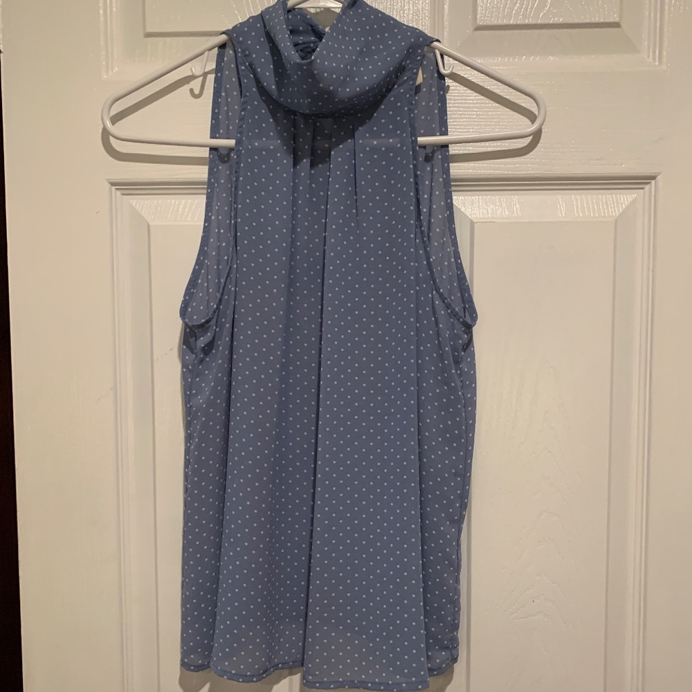 light blue with white polka dots, high neck, sleeveless top